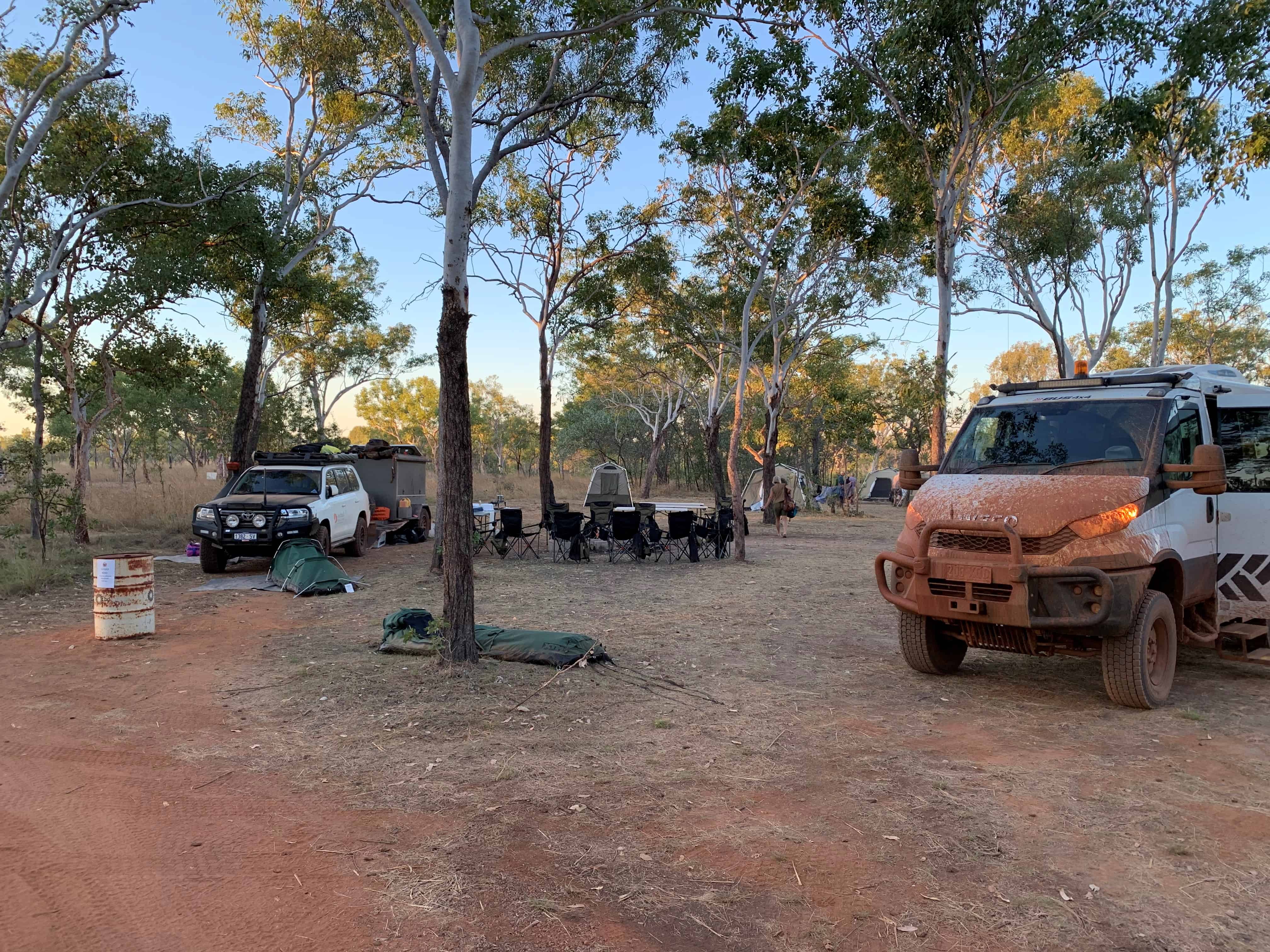 Outback Horizons campsite at Mitchell Falls with swags set up and fold out chair circle on Kimberley tour