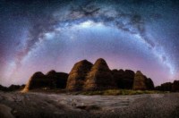 The Milky Way arches over the Beehive domes in Purnululu National Park .The night sky in Outback Australia.